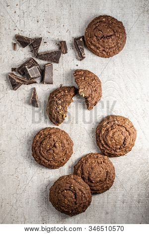 Cereal cocoa cookies on old kitchen table. Top view.