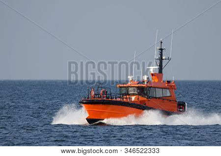 Pilot Boat -  Orange Auxiliary Boat On The Water