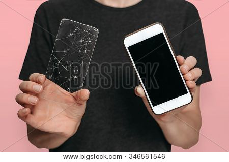 Worker Of Service Center Holding Undamaged Smartphone And Its Cracked Screen Protection In Her Hands