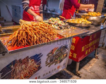 Changsha/china-17 October 2018:roasted  Squid In Food Alley At Huangxing Walking Street In Changsha 