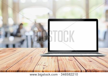 Laptop Blank Mock Up Screen Placed On Wooden Table On Defocused Customer At Restaurant Cafe Coffee S