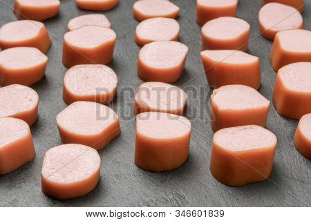 Many Pieces Of Fresh Pork Sausages Of Different Sizes Are Cut For Frying And Adding To Soup. Semiman