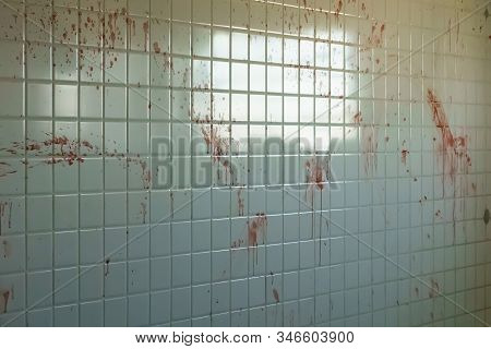 Blood Spattered Tiles Of A Bathroom. Smudged Handprints On The Wall Of A Fictional Crime Scene.