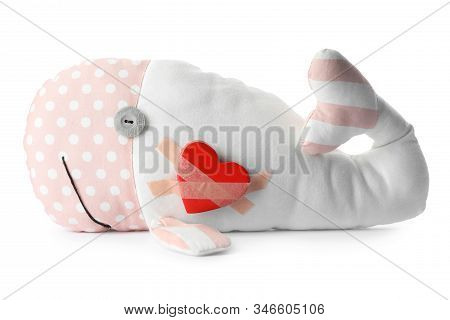 Toy Whale With Red Heart Attached By Sticking Plasters Isolated On White
