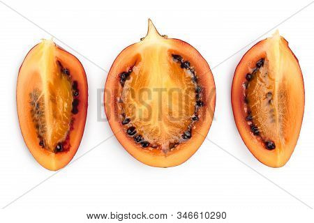 Fresh Tamarillo Fruit Slices With Leaves Isolated On White Background. Top View. Flat Lay. Set Or Co