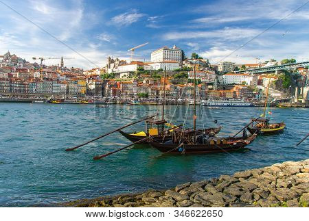 Portugal, City Landscape Porto, Wooden Boats With Wine Port Barrels Close Up On Douro, Panoramic Vie