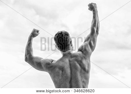Victory And Success. Champion And Winner Concept. Man Celebrating Success. Bodybuilder Strong Muscul