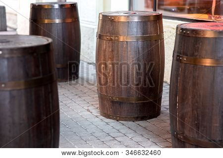 Brown Wooden Rum Barrel On The Street On Stone Paving Slabs, Bar Restaurant Decorations Close Up Nob