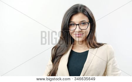Portrait Of Smiling Young Dark Haired Woman Wearing Spectacles Isolated On White Background Looking 