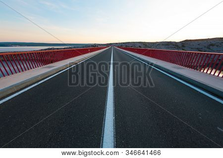 Red Bridge Over The Canyon In Croatia At Sunset. View From The Bridge To The Canyon In The Krka Nati