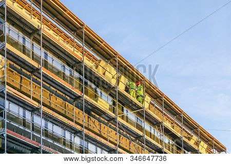 Scaffolding Arround The House To Install Thermal Insulation Of The Apartment Building Facade