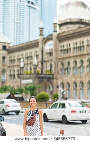 The Kuala Lumpur Railway Station. Malayan Railways Hub. Young Woman Tourist Walk Around Building. Ku