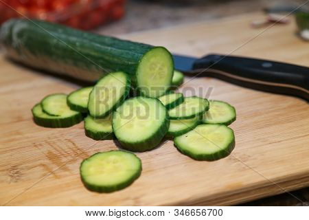 Cucumbers - Cucumber Slices On Chopping Board