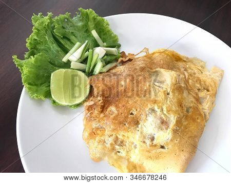 Traditional Thai Cuisine, Stir Fried Noodle Or Phad Thai Wrapped With Omelet
