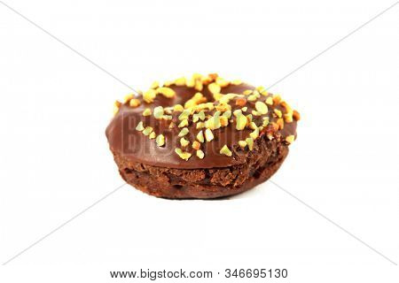 chocolate Donut with peanuts. isolated on white. room for text. clipping path. People world wide enjoy donuts. Enjoy a Donut today. 