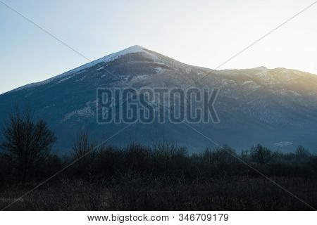 Sunrise In Mountain Landscape. Mountain In Sunrise. Sunrise In Mountain Forest Landscape. Forest And