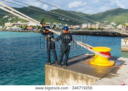 Road Town, Tortola, Bvi - December 16, 2018: On The Mooring Platform A Workers Put Marine Rat Guard 