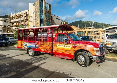 Road Town, Tortola, Bvi - December 16, 2018: The Colorful Tour Bus Pirates Of The Caribbean Waiting 