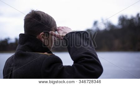 Naval Soldier Junior Lieutenant In A Black Cloak Meets A Ship.