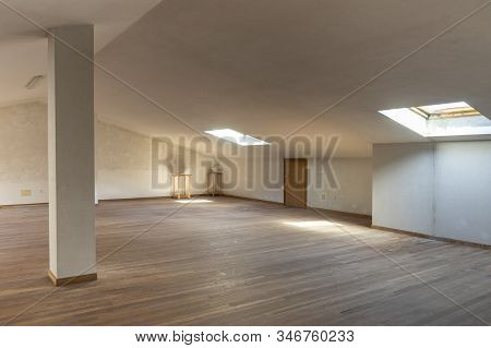 White And Empty Attic With Wooden Floor