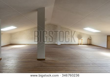 White And Empty Attic With Wooden Floor