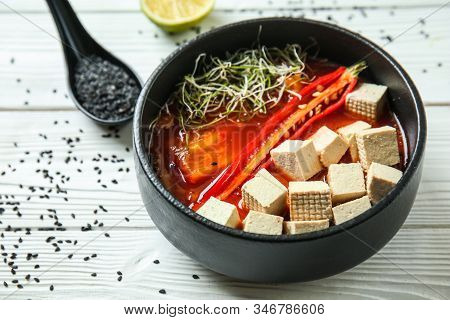 Tasty Soup With Tofu Cheese In Bowl On White Table