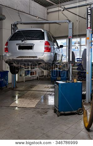Novosibirsk, Russia - 08.01.2018: One Silver Used Car Acura Mdx Raised On A Lift For Repairing The C