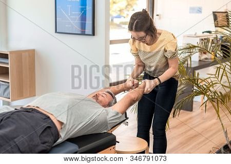 Man Having Chiropractic Back Adjustment. Physioterapy, Osteopathy, Alternative Medicine Pain Relief 