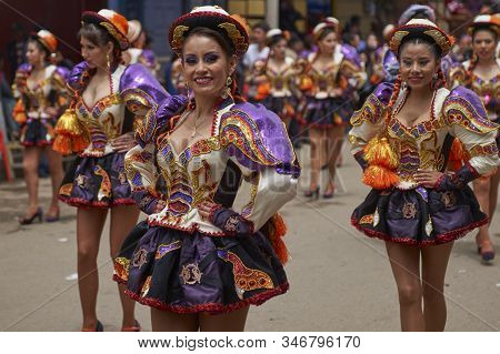 Oruro, Bolivia - February 26, 2017: Caporales Dancers In Ornate Costumes Performing As They Parade T