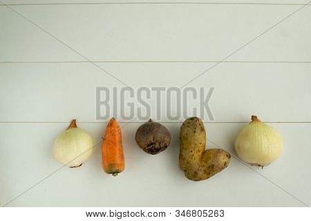 Ugly Vegetables. Vegetables On A White Background. Top Viev. The Form Does Not Affect The Taste, Ugl