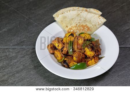 Top Down View Of Paneer Shimla Mirch Or Paneer Capsicum Or Tofu Capsicum On A Grey Background, Selec