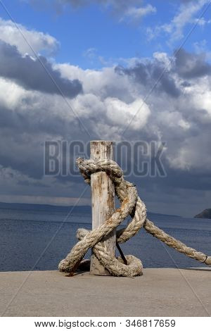 Rope On Seafront, Sea And Beautiful Cloudy Sky In Sun Summer Day. Turkey, Erdek, Coast Of Marmara.