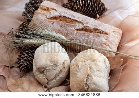 White Muffins With Wheat Spike And Sliced Bread Decorated With Pineapple