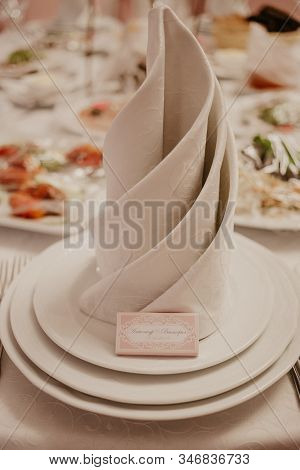 Banquet Table With Wedding And Festive Serving.table Covered With A Tablecloth And Served With Dishe