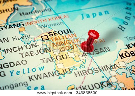 Prague, Czech Republic - January 12, 2019: Red Thumbtack In A Map. Pushpin Pointing At Pusan City In