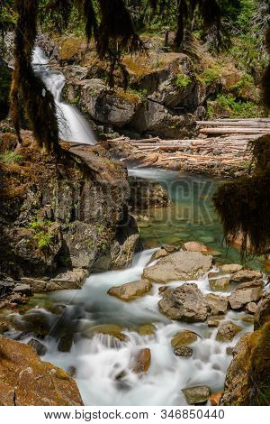Long Exposure Of River Running Below Silver Falls In Washington Wilderness