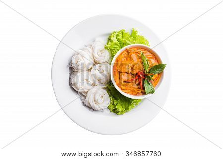 Above View Of Rice Noodles In Chicken Red Curry Preserved Bamboo Shoot With Vegetables In White Plat