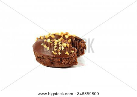 chocolate Donut with peanuts. isolated on white. room for text. clipping path. People world wide enjoy donuts. Enjoy a Donut today. 
