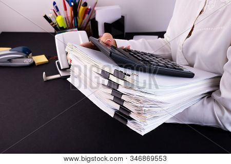 Business Woman Office Workers Holding Are Arranging Documents Of Unfinished Documents On Office Desk