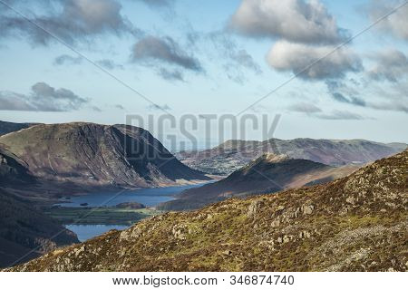 Epic Autumn Fall Landscape Of Buttermere And Crummock Water Surrounded By Mountain Peaks In Lake Dis