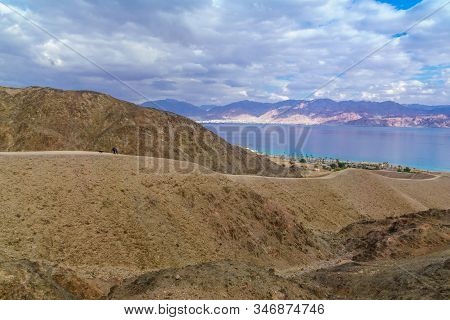 Eilat, Israel - January 18, 2020: View Of The Gulf Of Aqaba, With Hikers. Eilat Mountains, Southern 
