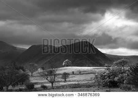 Stunning Autumn Fall Landscape View Along Valley Towards Mellbreak And Grasmoor In Lake District Wit
