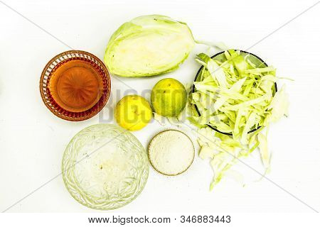 Close Up Of Cabbage Face Mask Isolated On White. Horizontal Top Shot Of A Bowl With Some Cabbage Pas