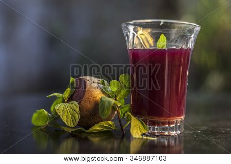 Healthy Beetroot Juice For Weight Loss In A Glass On Black Glossy Surface Along With Some Raw Fresh
