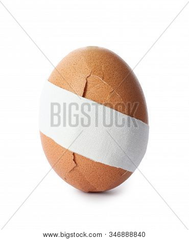 Cracked Egg With Sticking Plaster Isolated On White