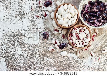 Colored Beans In Wooden Cups On A Light Background