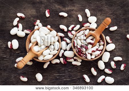 Colored Beans In Wooden Cups On A Dark Wooden Background