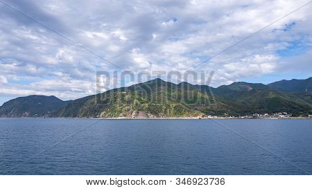 Landscape View Of Mountain Over Blue Sky And White Cloud From The Ferry Boat In The Ocean At Suruga 