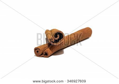 Flavored Cinnamon Sticks Isolated On A White Background. Two Sticks Of Dried Cinnamon Isolated On A 