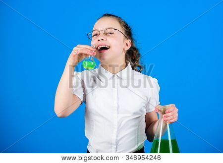 Science Research In Lab. Small School Girl. Small Smart Girl With Testing Flask. Child Study Bilogy 